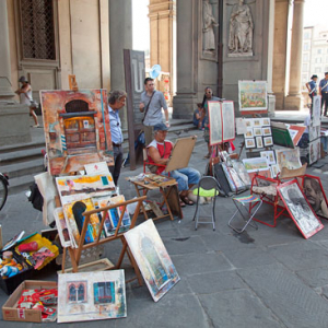 Artysta malujacy obrazy przy The Uffizi Gallery. EU, Italia, Florencja.